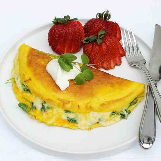 Pea shoot and swiss cheese omelet