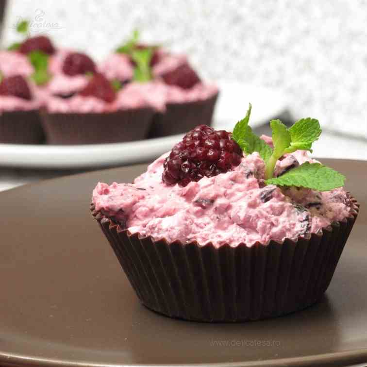Chocolate cups with berries mousse