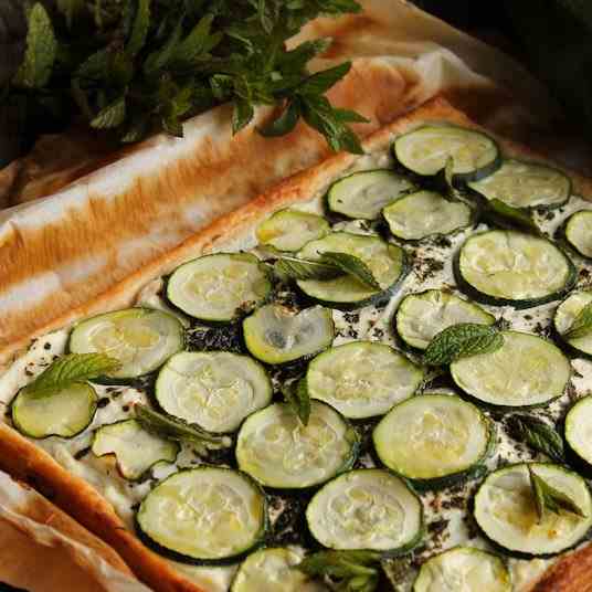 Zucchini pie with ricotta and mint