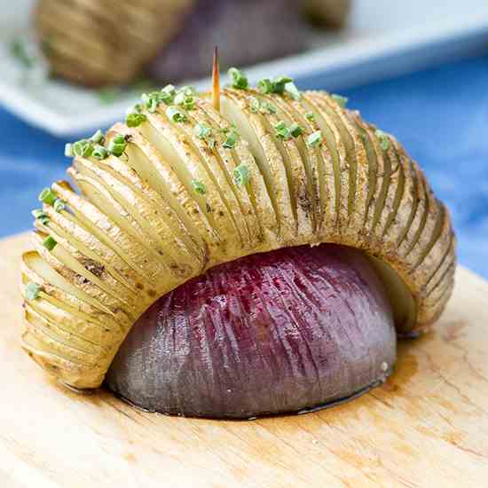 Hasselback Potatoes Over Roasted Red Onion