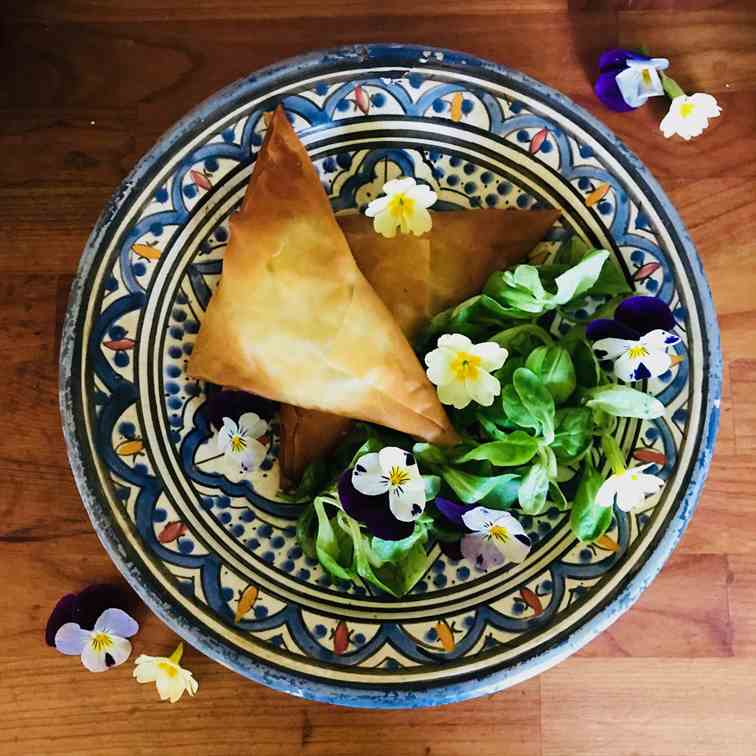 Filo triangles with edible flower salad
