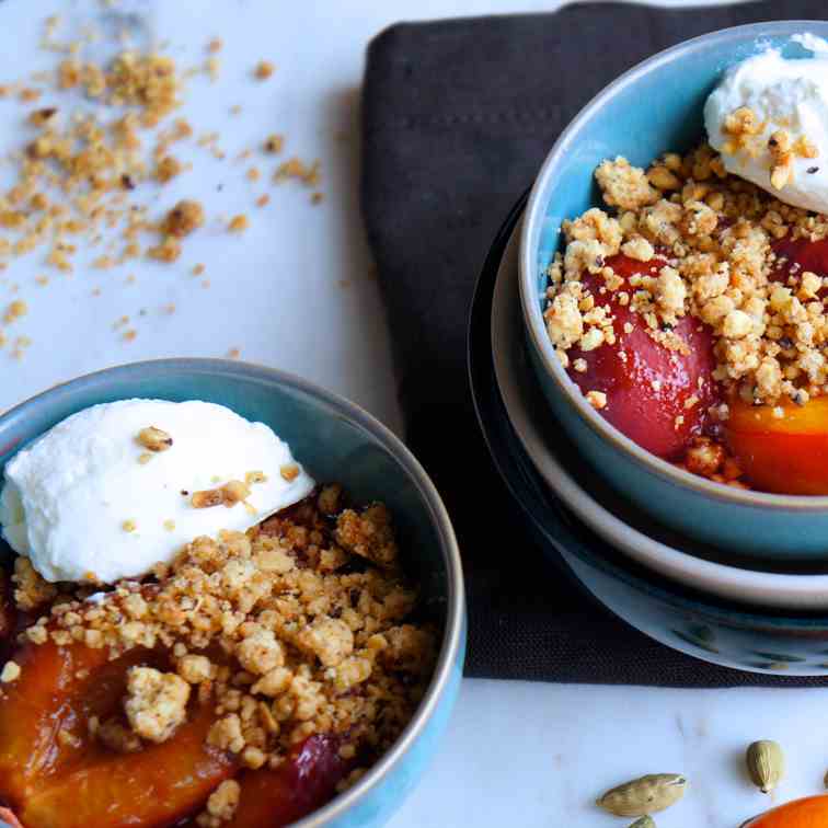 Baked plums with cardamom and nutty crumbl