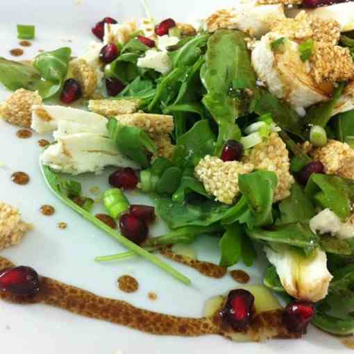 Arugula salad with pasteli and pomegranate