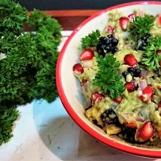 Guacamole with berries and pomegranate
