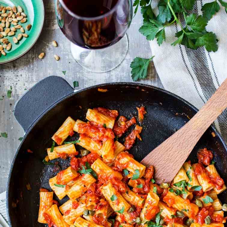 Vegan rigatoni with saffron, capers and to