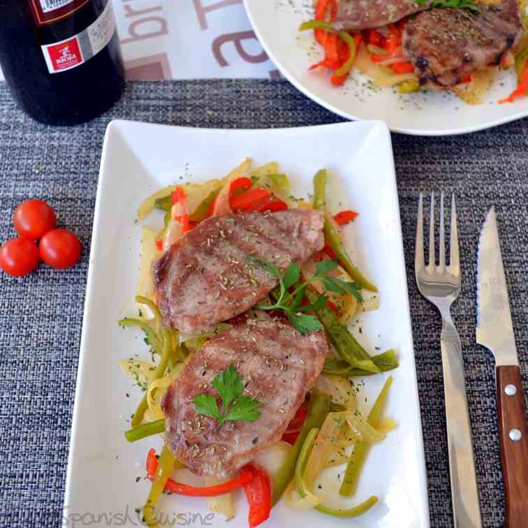 Grilled pork shoulder steaks