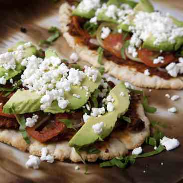 Huaraches topped w/ Chorizo Refried Beans