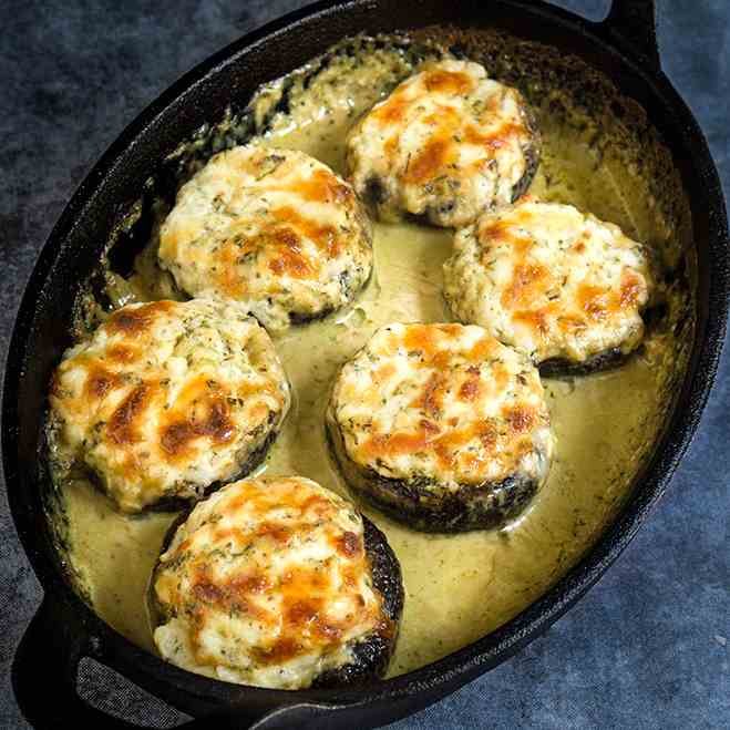 Stuffed mushrooms in creamy pesto sauce