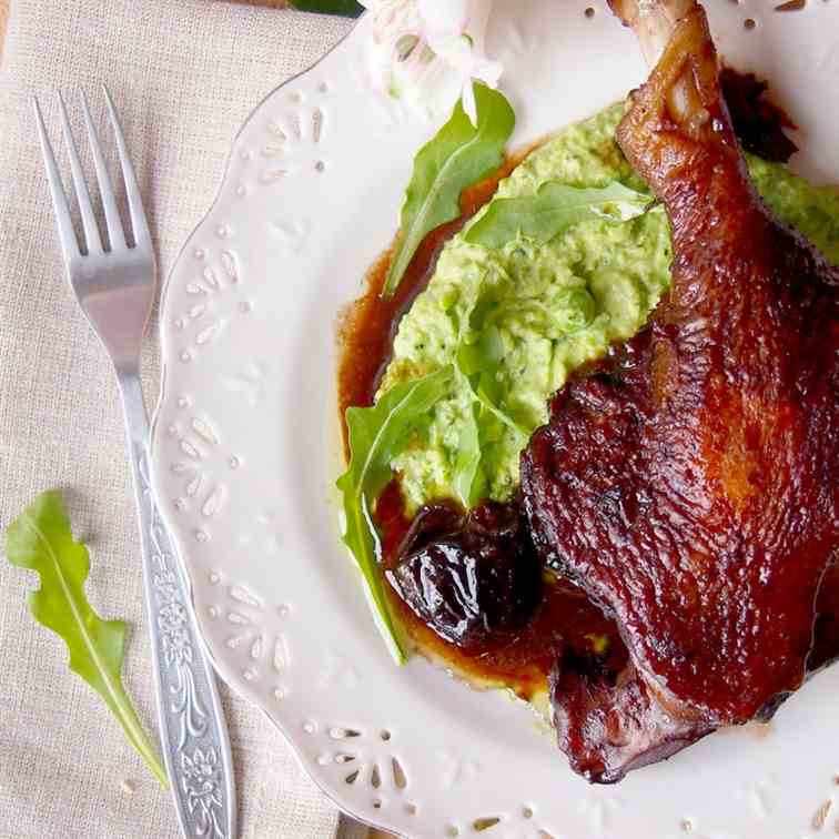 Duck legs braised in red wine with prunes.