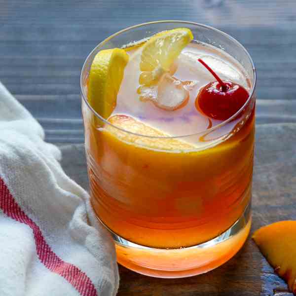 fresh peach and bourbon sour