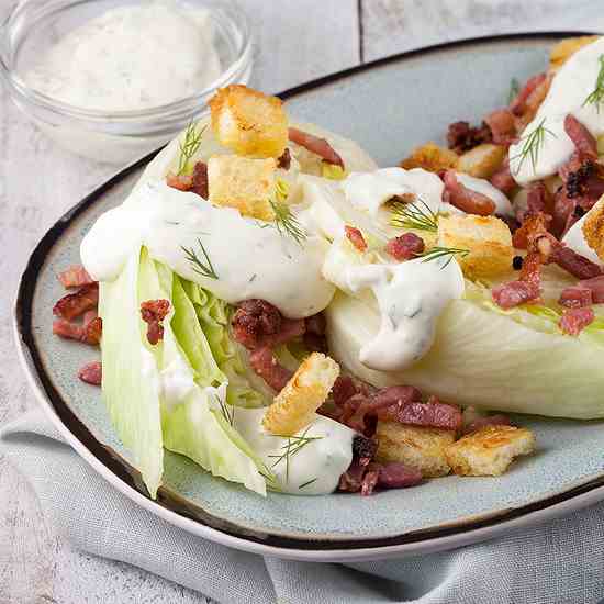 Iceberg quarters with grilled bacon and cr