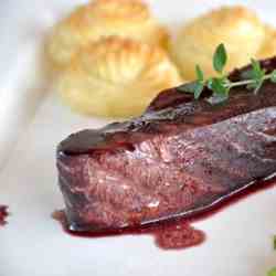 Salmon in red wine and thyme sauce