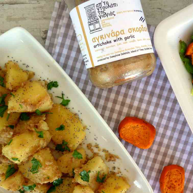 Potato salad with artichoke garlic spread