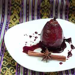Poached pear in red wine spice sauce