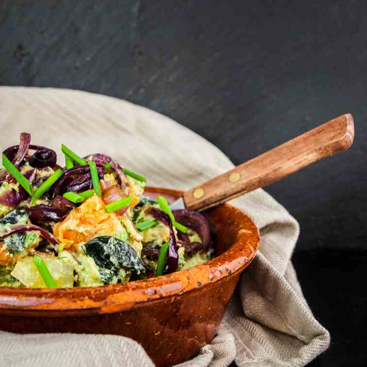 Creamy potato salad with avocado and onions