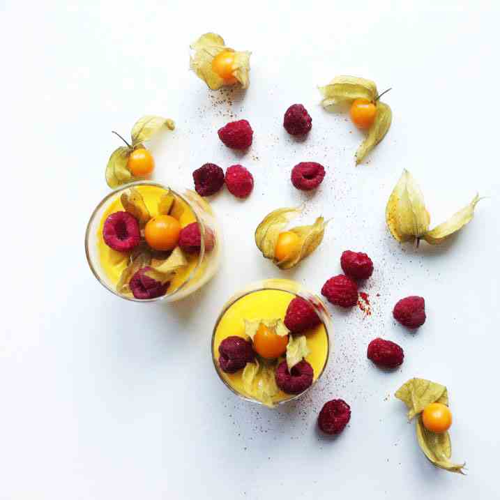 Saffron pannacotta with raspberries