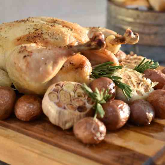 Roast Chicken with Potatoes and Garlic 