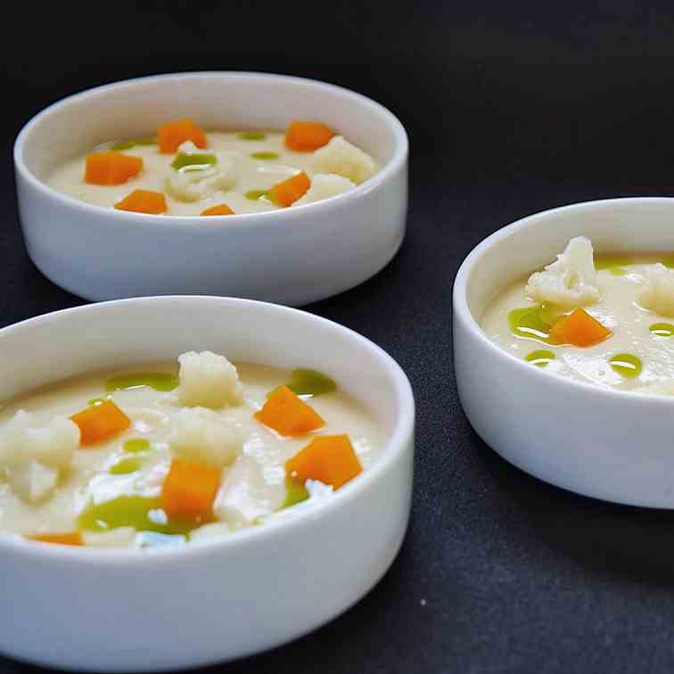 Cream of cauliflower soup with diced pumpk