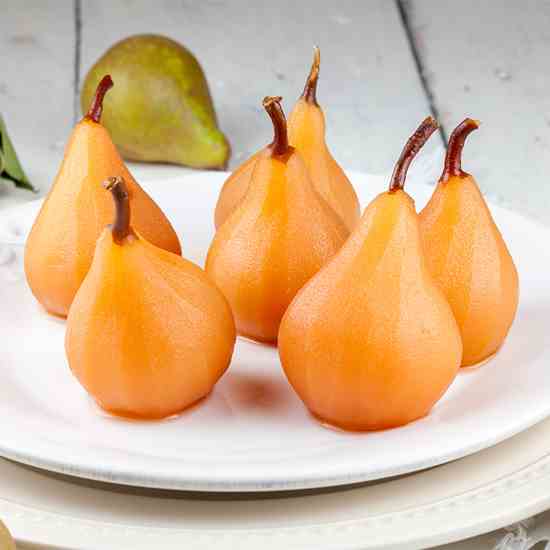 Poached pears in apple juice