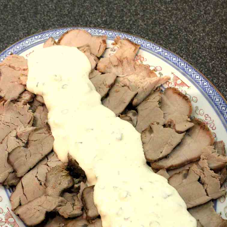 Cold pork fillet with sour cream sauce