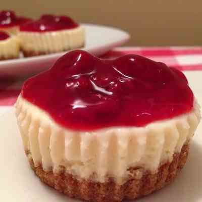 Cheesecake Cupcakes with Raspberry Sauce