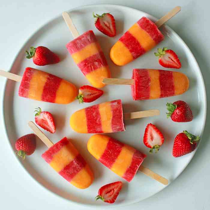 Fresh mango and strawberry popsicles