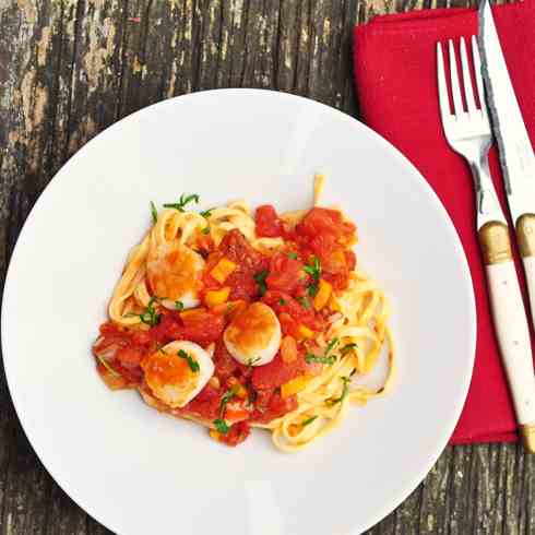 Scallops with chorizo over linguine