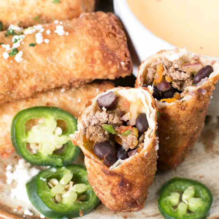 Loaded Nacho Egg Rolls with Queso Dip