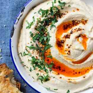 Smooth hummus topped with chilli oil