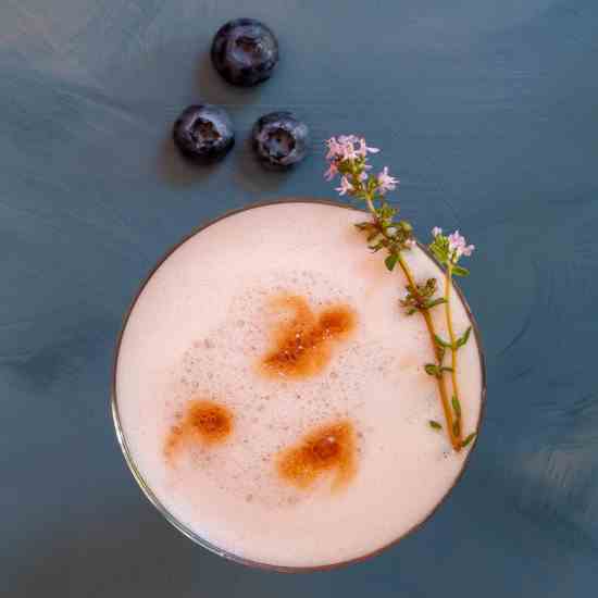 Blueberry shrub pisco sour cocktail