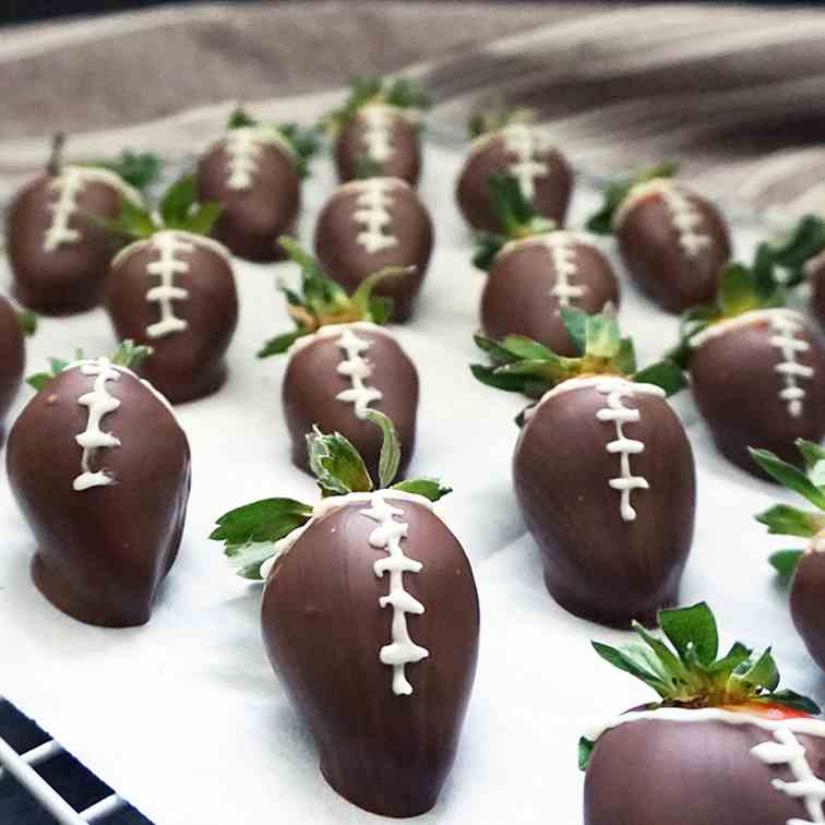 Chocolate covered strawberry footballs