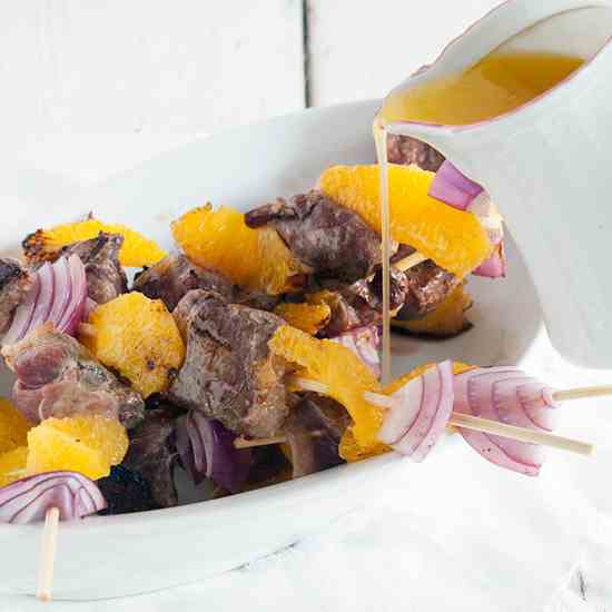 Duck kebabs with orange butter sauce